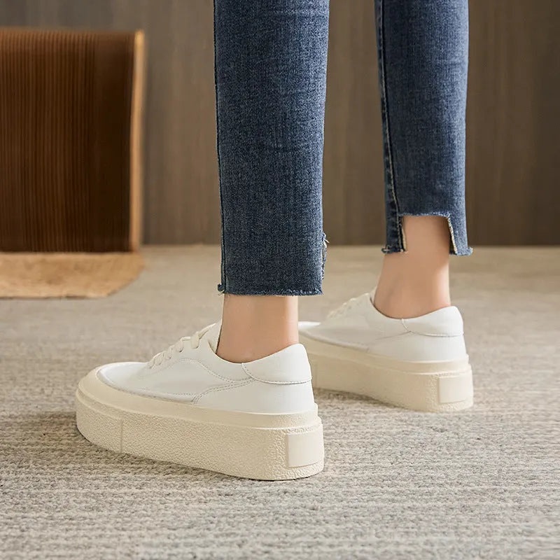Women's black platform board shoes with embossed cowhide leather upper and round toe design