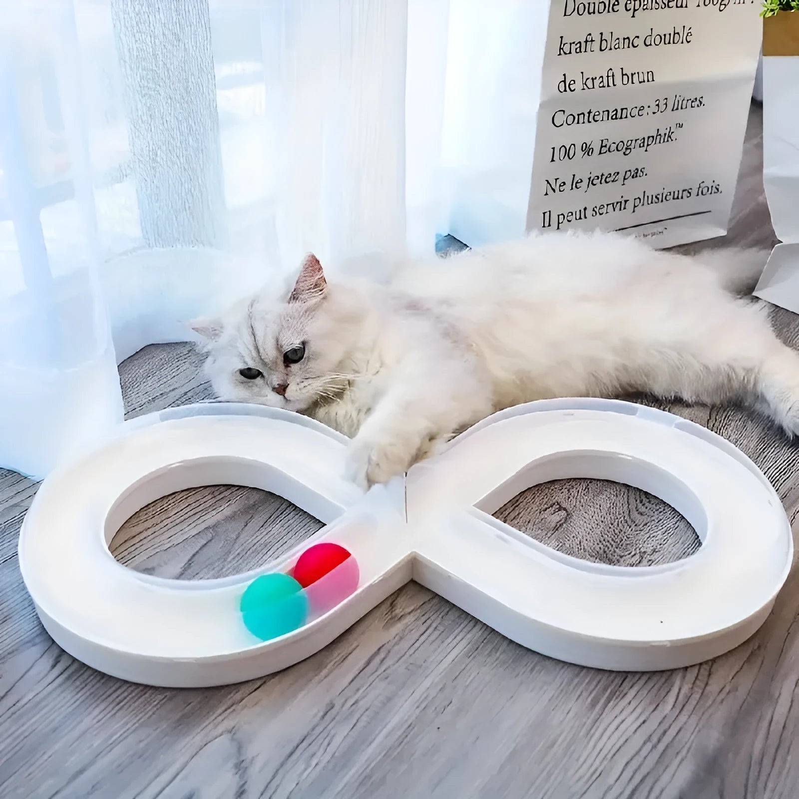 Blue and white cat turntable track ball toy with spinning mechanism for interactive play