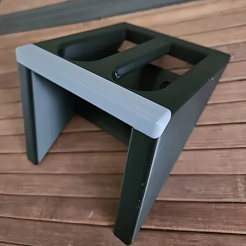 Black punk-style plastic pistol display stand for toy guns and model firearms.