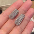 Geometric copper stud earrings with zircon inlay in white gold colour