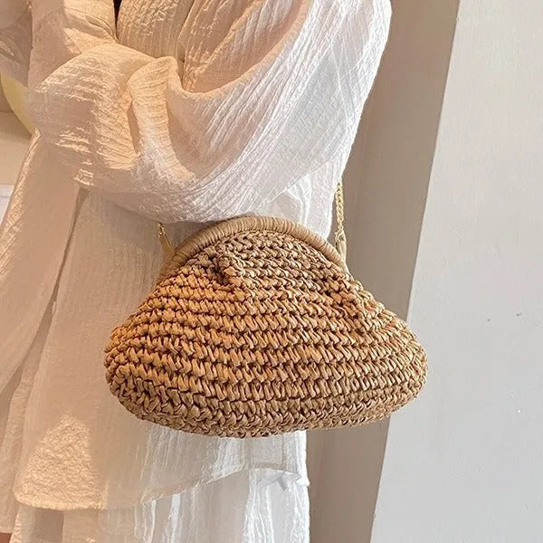 Shell-shaped straw shoulder bag with chain detailing and internal zipper pocket