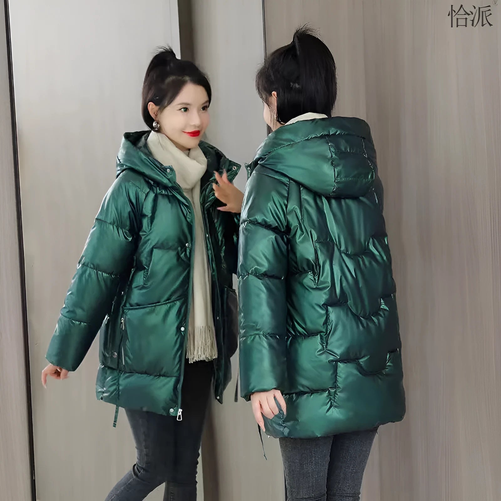 Women's loose thick hooded winter jacket in green colour shown on a model.