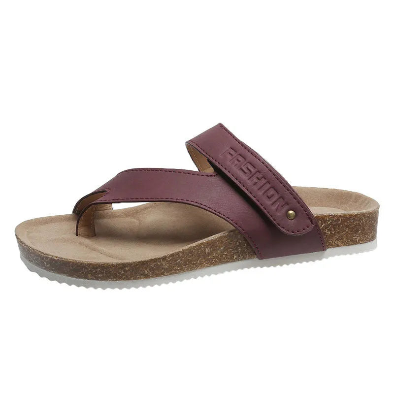 Women's blue flip-flops with a thick foam sole and a flat toe ring design on a solid colour artificial PU upper.