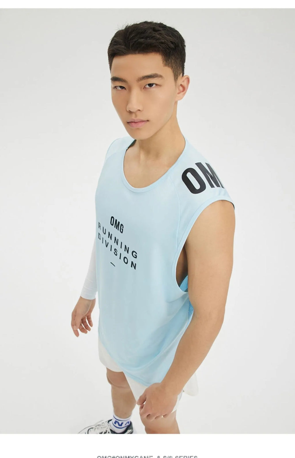 Men's loose fit black sports vest made of lightweight mesh fabric for wicking moisture during exercise.