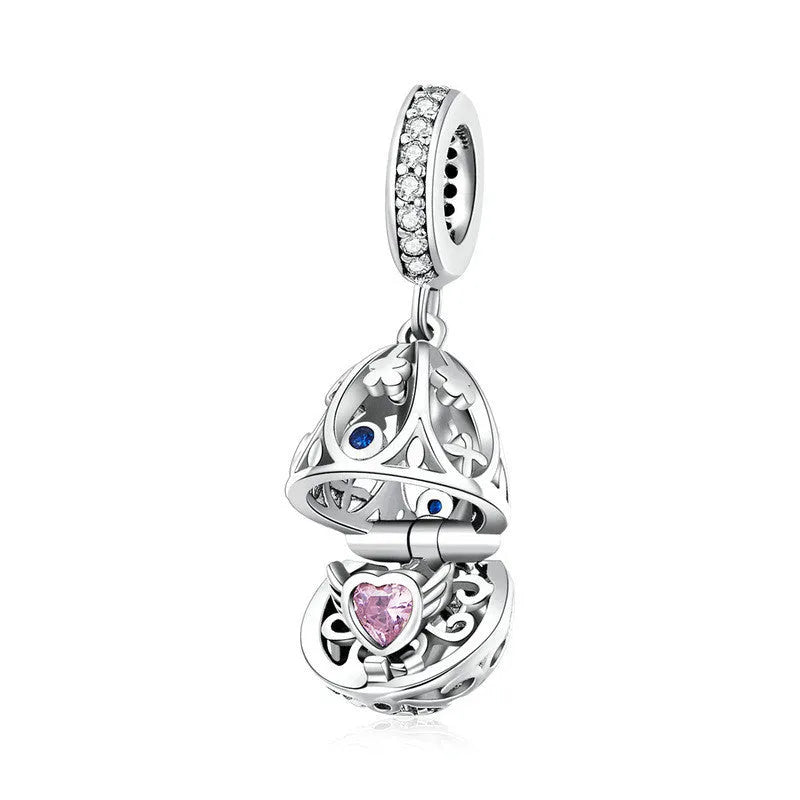 Silver electroplated loose bead pendant 2.3cm high 1cm wide on plain background