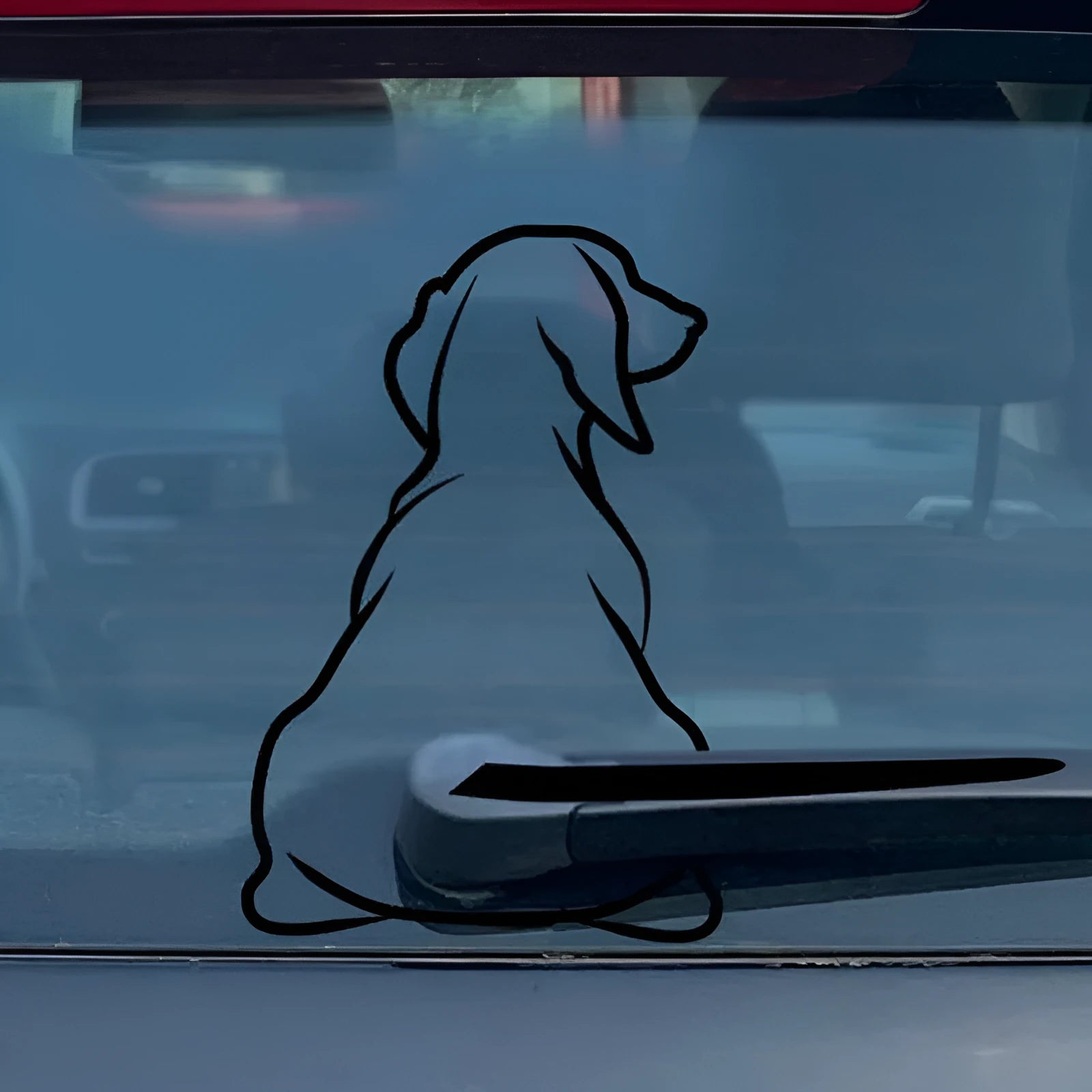 Cartoon dog car rear window sticker with wiper back design in black or white colours.