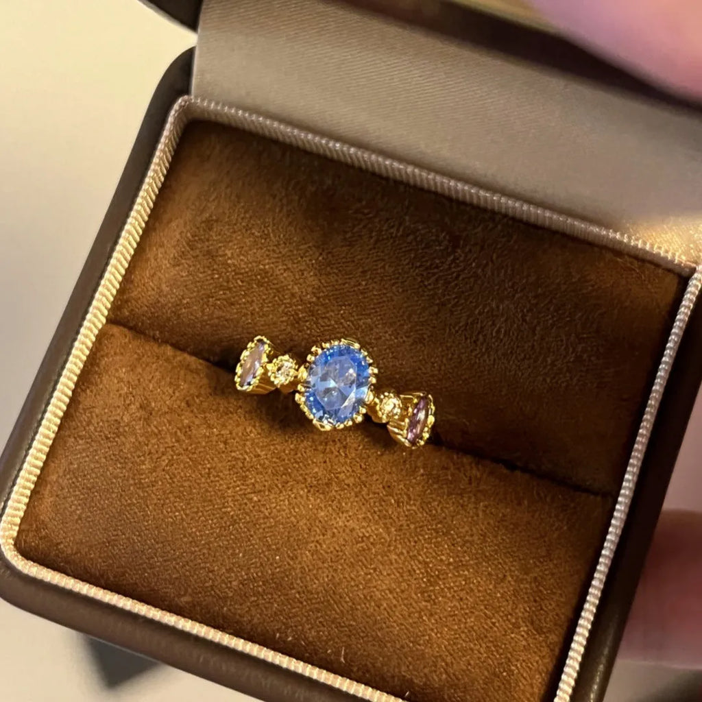 Vintage copper ring with blue gemstone and snowflake ice flower design