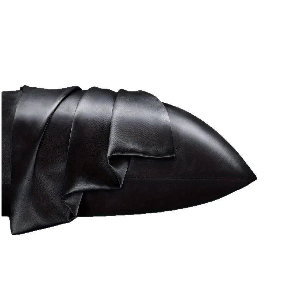 A pair of solid-colour polyester satin pillowcases in a selected shade, shown folded.