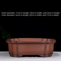 Large antique-style purple clay Chinese flower pot showing wide, shallow shape.