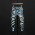 Men's dark blue skinny jeans with a slim fit and mid waist, laid flat.