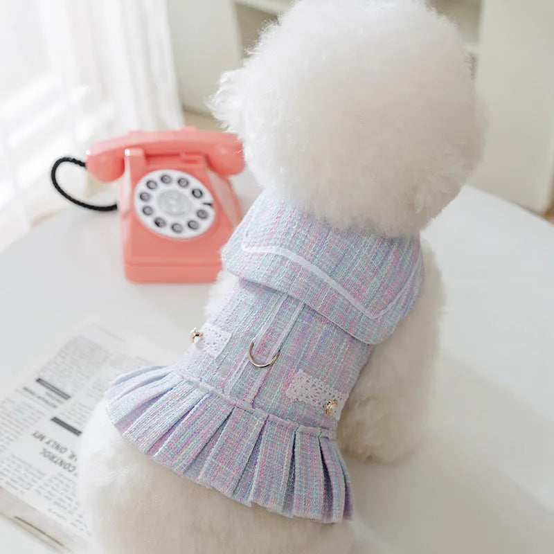 Purple and pink polyester pet clothing for small cats and dogs on a white background, showing size tags S, M, L, XL.