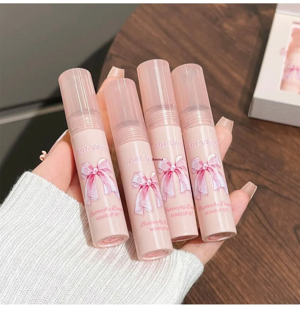 Butterfly Box Suite cosmetics set with four lip mud pots, powder blusher, and necklace in pink packaging