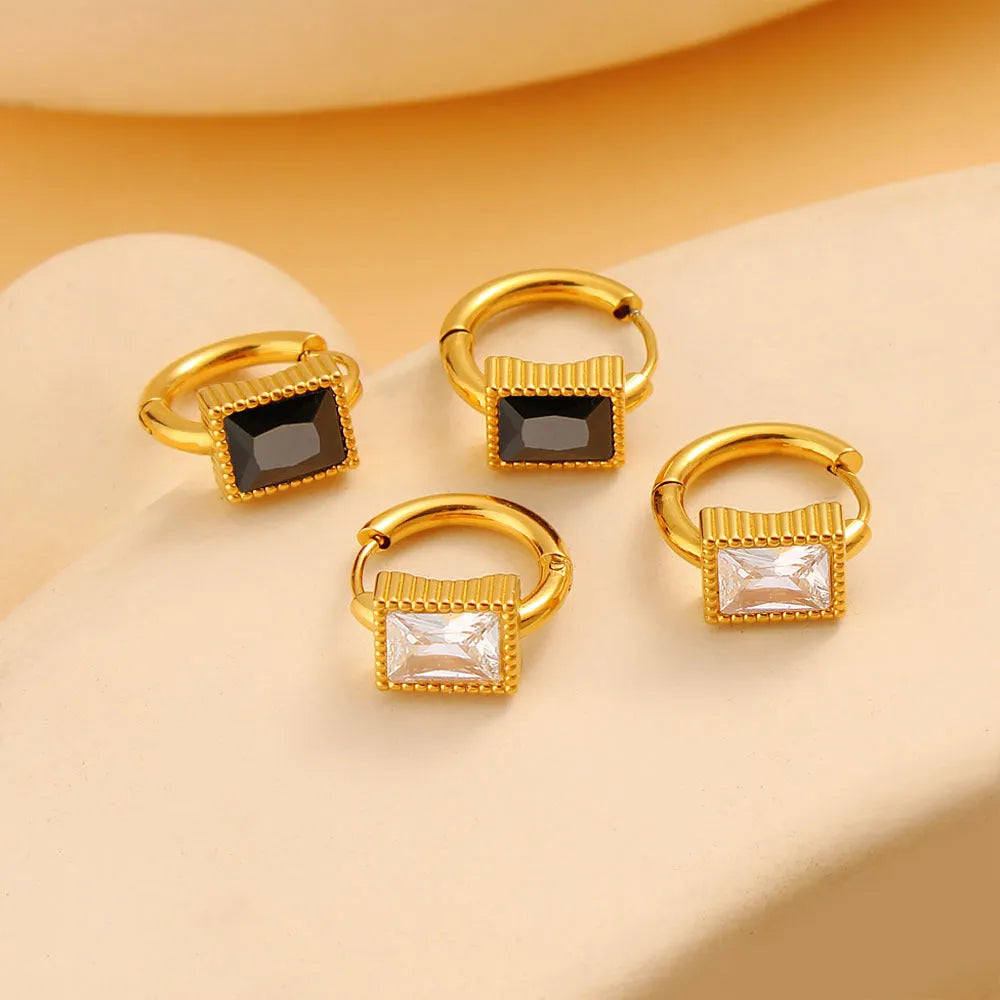 Stainless steel earrings with square zircon stones in geometric design with round ring elements
