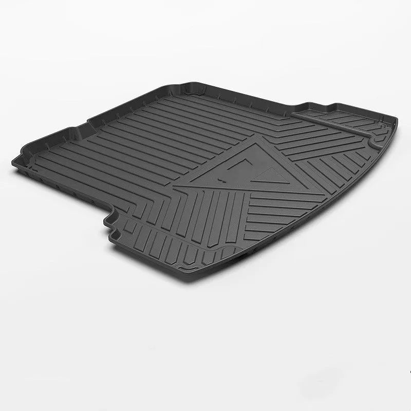 Black TPE car trunk pad with carbon fibre pattern installed in vehicle tailbox