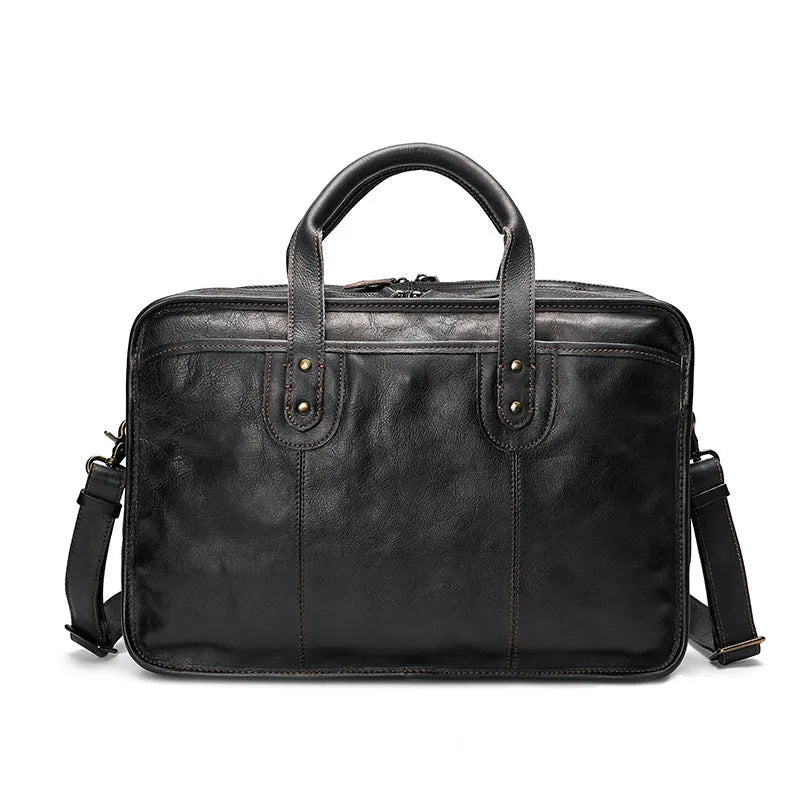 Men's leather briefcase showing multiple interior organisational pockets including laptop compartment