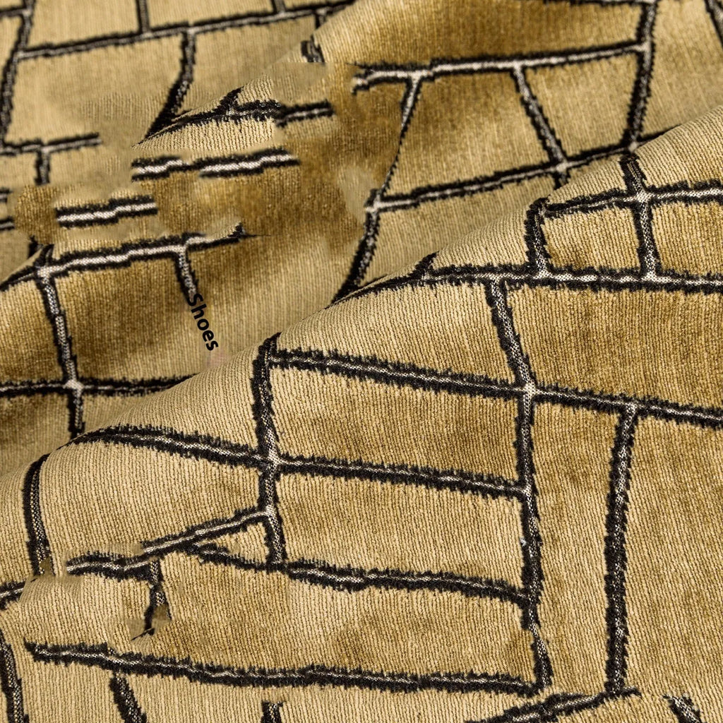 Gold and white abstract geometric patterned cushion cover on a grey sofa, showing 45x45cm square size option.