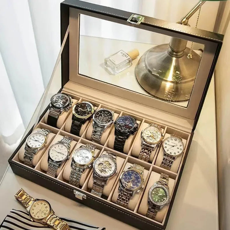 Grey high-grade leather watch storage box with a clear, dustproof lid on a table.