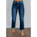 Women's solid colour denim jeans with hand-worn distressing in dark blue on a model