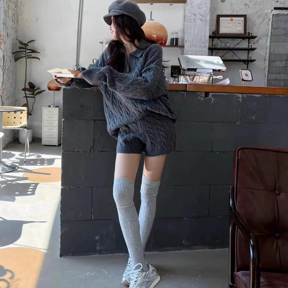 Women's geometric cable knit suit set with long sleeve sweater and elastic waist shorts in creamy-white, black, or gray.