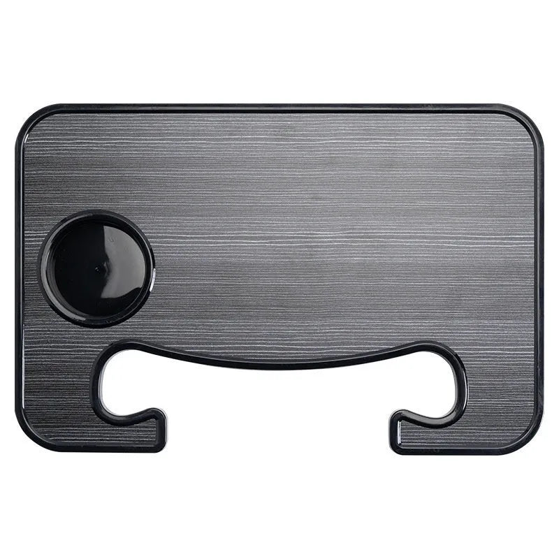 Black foldable car steering wheel laptop stand with integrated cup holder on a car seat.