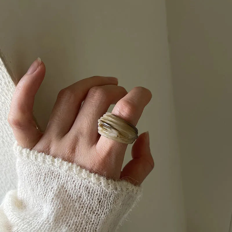 Chinese style irregular geometric resin wide ring in brown and white colours.