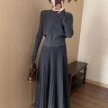 Women's dark grey knitted dress suit with 3D patterning and ethnic collage stitching, showing sweater and skirt two-piece set