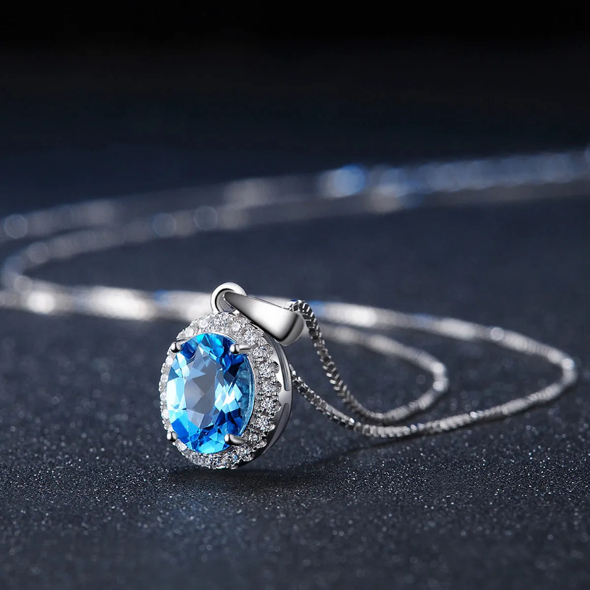 925 sterling silver blue topaz jewellery set with geometric design including earrings, ring, pendant and necklace