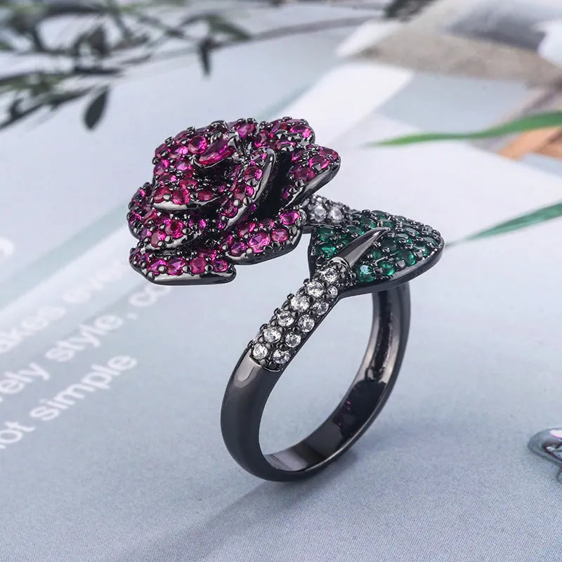 Gold-plated black gold flower personality ring with simulated red corundum stones