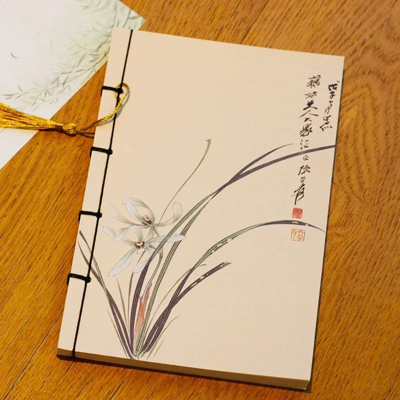 Antique wire-bound notebook with embossed cowhide cover and black wax rope binding