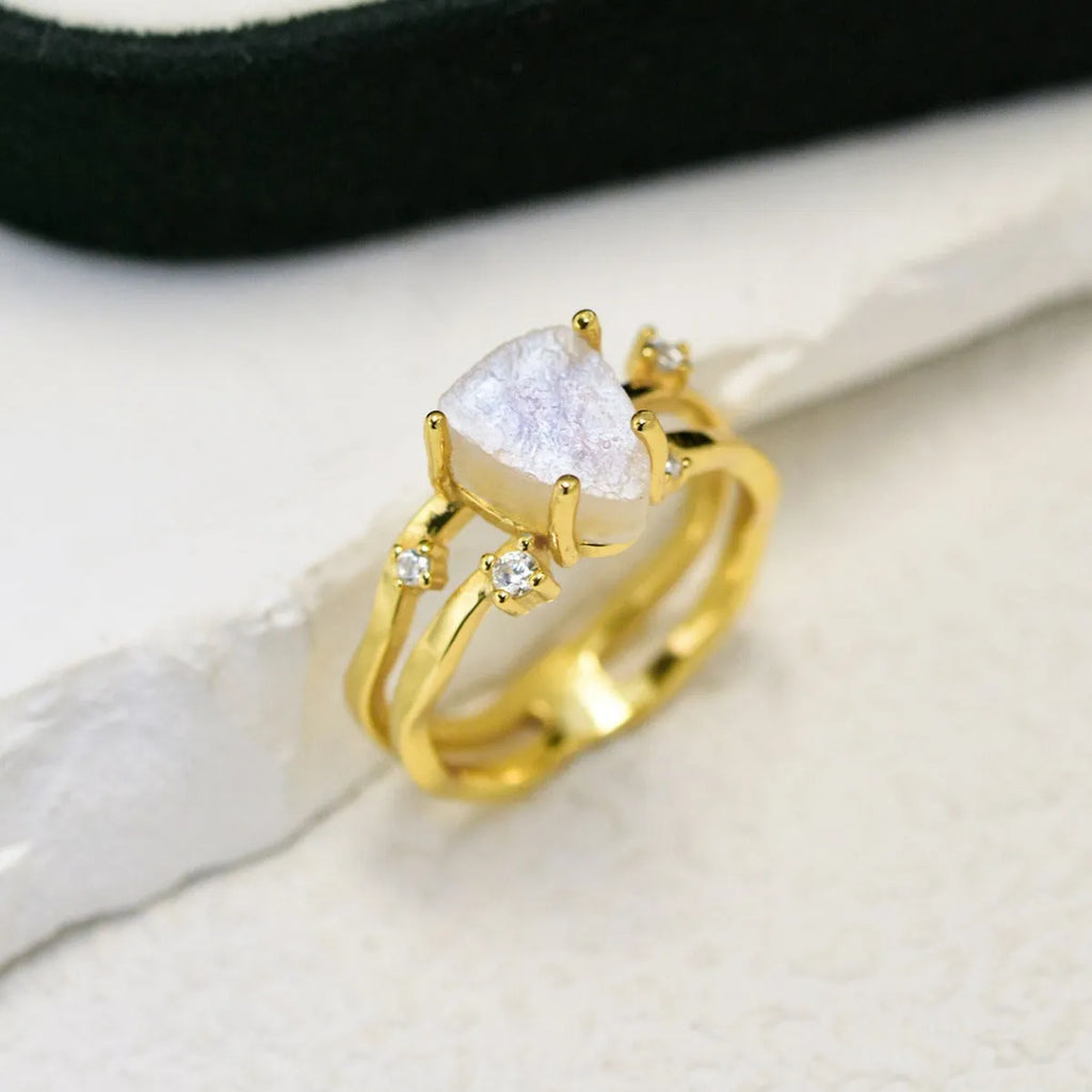 S925 silver ring with an irregular triangle shape holding a moonstone, shown in a rose gold electroplated finish.