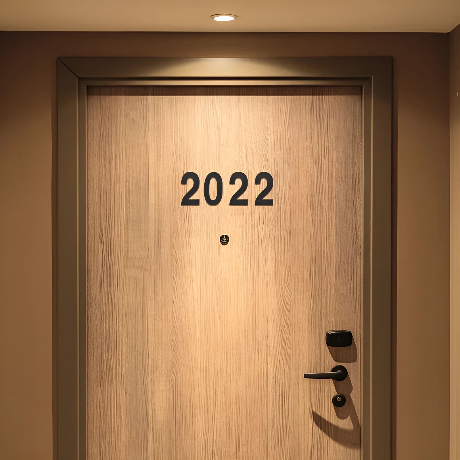 Black stainless steel sticky house number sign with 7.5cm character on adhesive backing