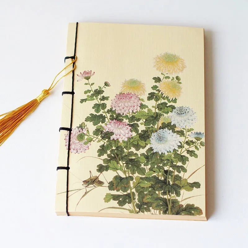 Antique wire-bound notebook with embossed cowhide cover and black wax rope binding