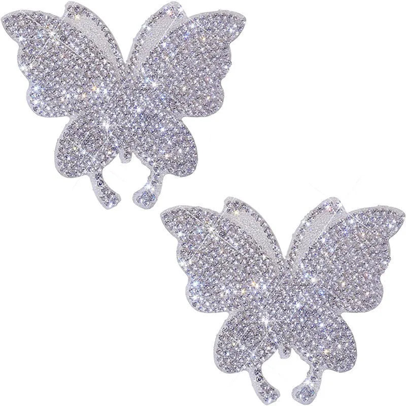 Glass car sticker with diamond-encrusted butterfly and bear paw design, 7cm by 6cm.