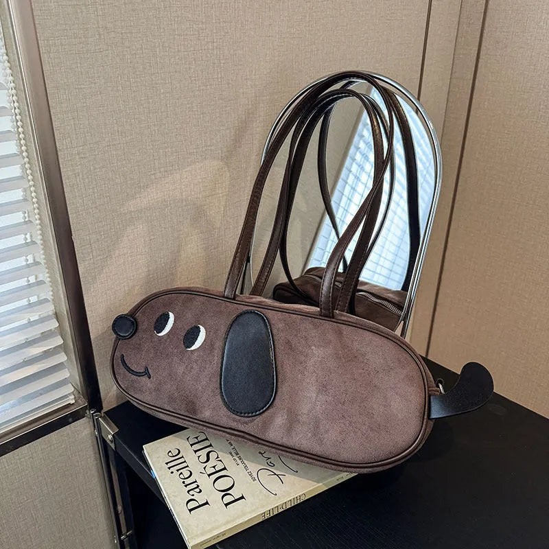 Sausage dog crossbody bag in coffee brown matte finish with single shoulder strap and horizontal shape