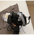 Women's casual PU leather handbag with a bandage bow decoration on the front.