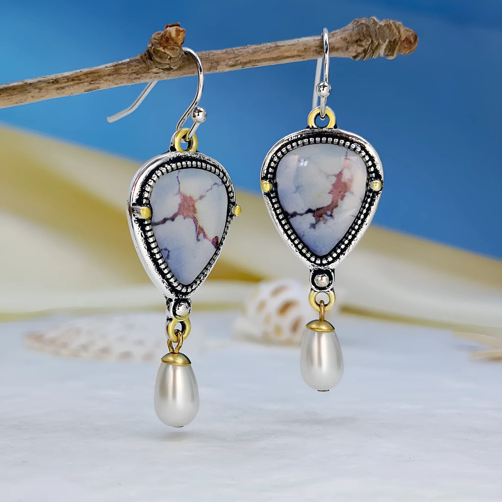 Retro blue women's drop earrings with geometric shape, synthetic opal and pearl details on electroplated metal.