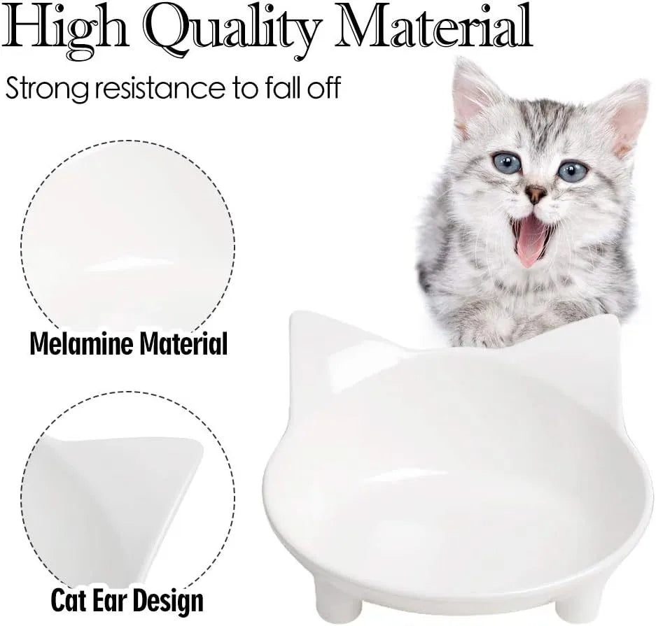 Set of four black shallow melamine pet bowls with non-slip rubber bases on a white surface.