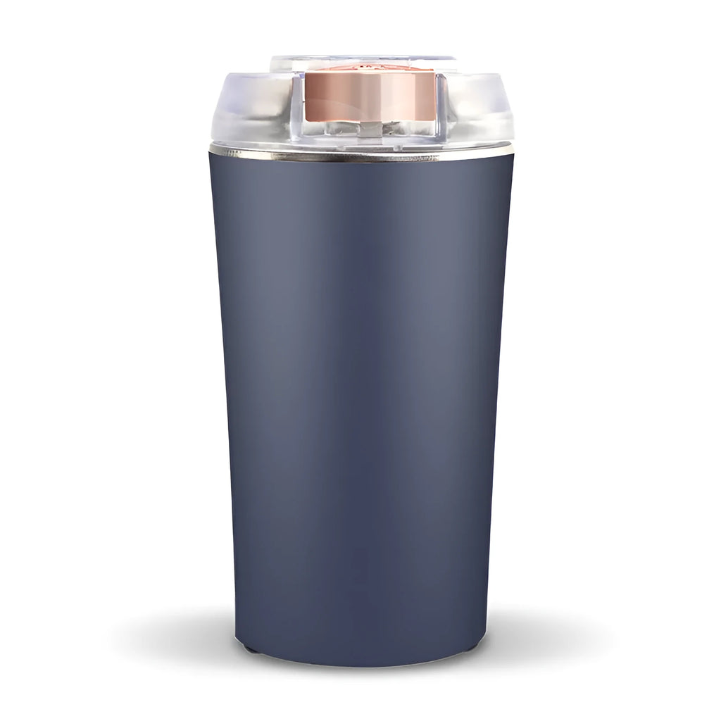 Blue mini electric flour mill and spice grinder with stainless steel grinding chamber.