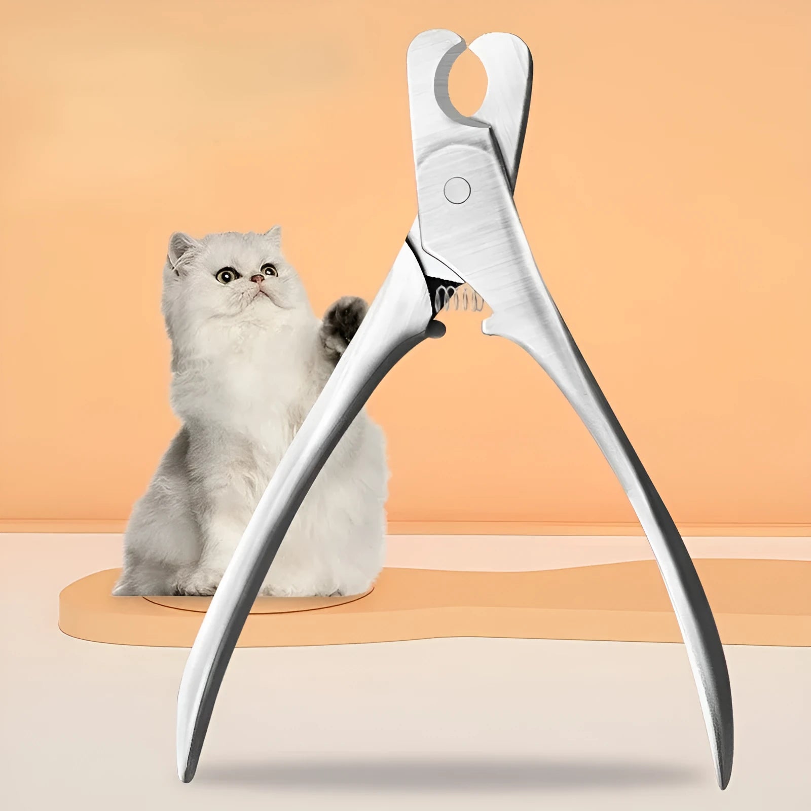 Silver stainless steel pet nail clipper with ergonomic handles and safety guard for dogs and cats