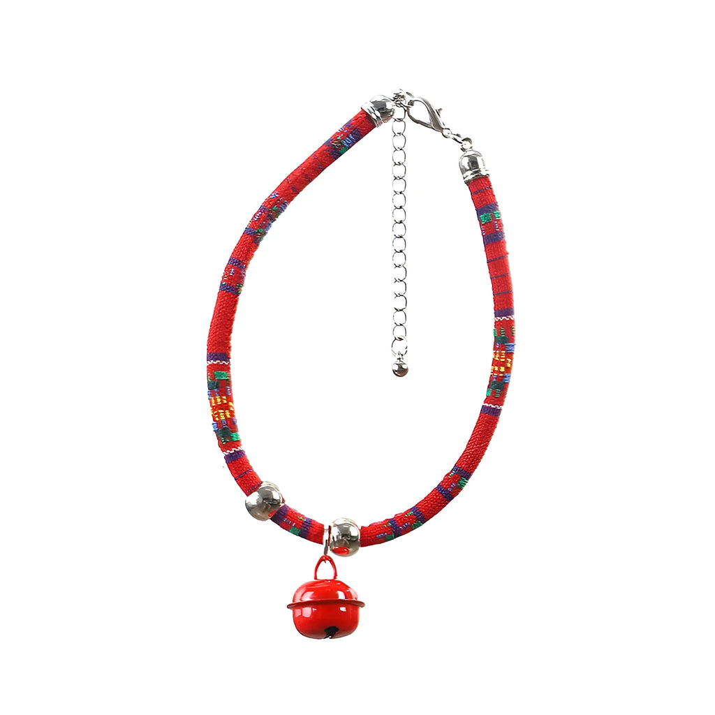 Coloured ethnic pattern adjustable pet collar for dogs and cats with a small metal bell attached.
