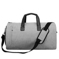 Light grey oval men's travel bag with internal compartments showing wet/dry separation and camera insert pocket.