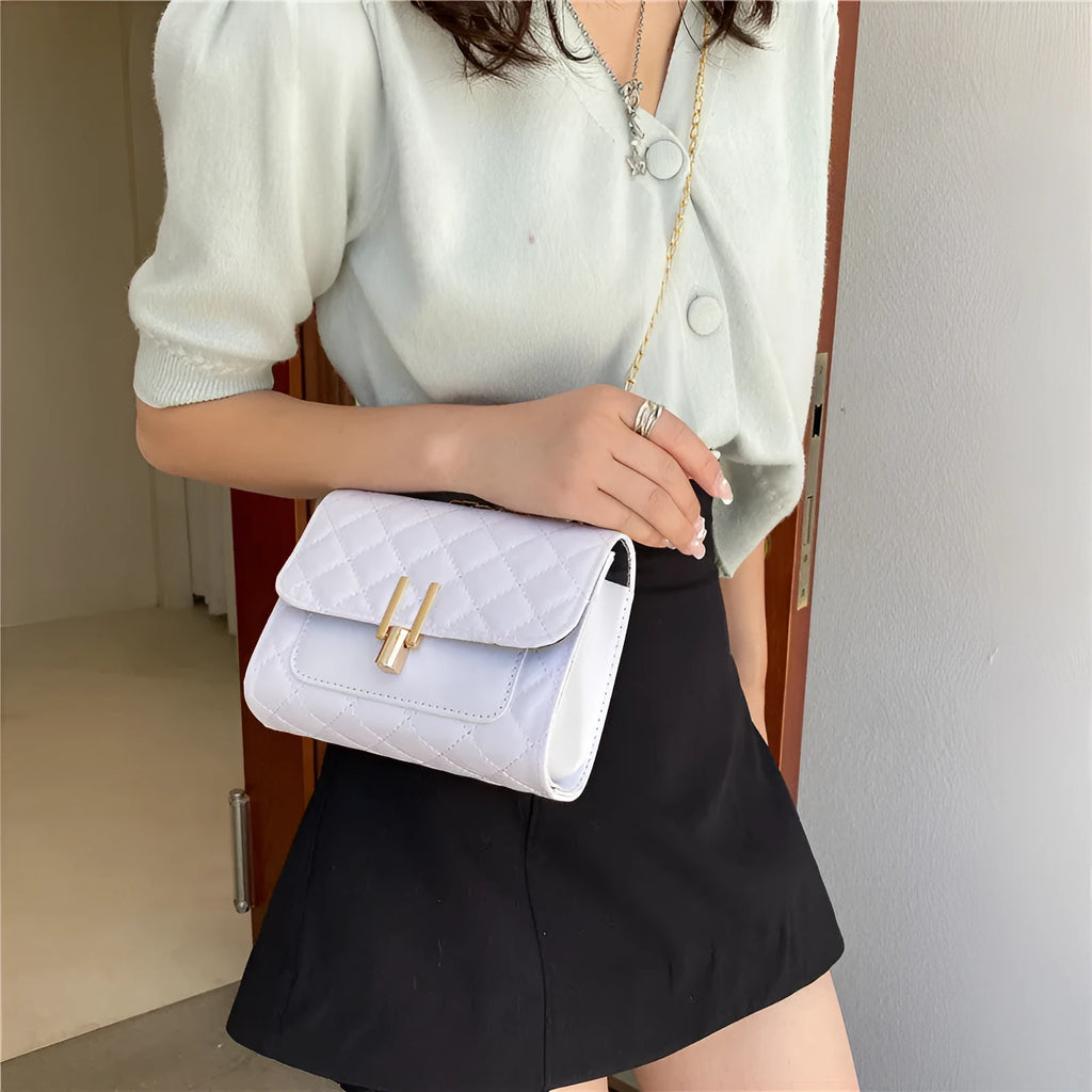 Women's minimalist crossbody bag with diamond lattice chain detail in black, white or green