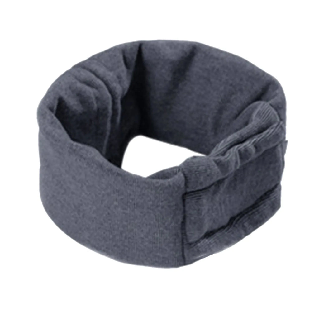 Dog wearing black calming hoodie head cover with ear wraps for noise reduction and anxiety relief