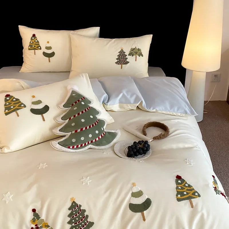 Cream blue embroidered Christmas tree and flowers on a cotton duvet cover with matching pillowcases