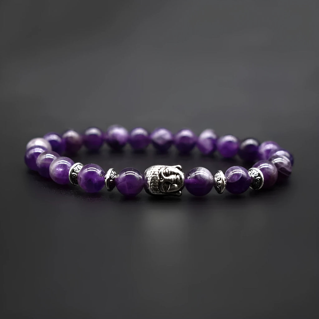 Unisex adjustable bracelet with a 19mm Buddha head charm in tiger eye stone.