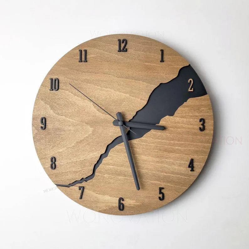 Modern round wooden wall clock with crackle design, white face, and black hands.