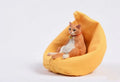 Lazy cat figurine on a small sofa, a 7.5cm tall resin car ornament for dashboard or shelf decoration.