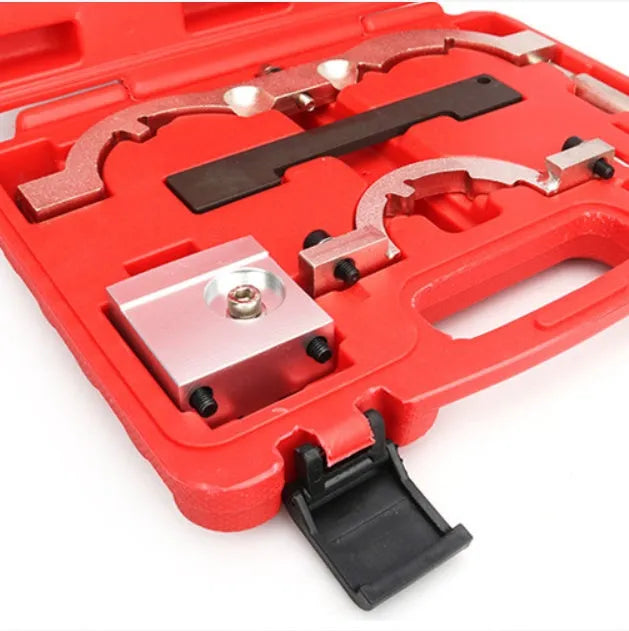 Red chrome-vanadium steel timing tool kit for Opel 1.4 LUJ engine on a workshop bench.