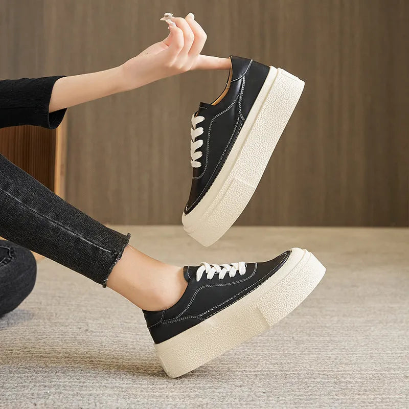 Women's black platform board shoes with embossed cowhide leather upper and round toe design