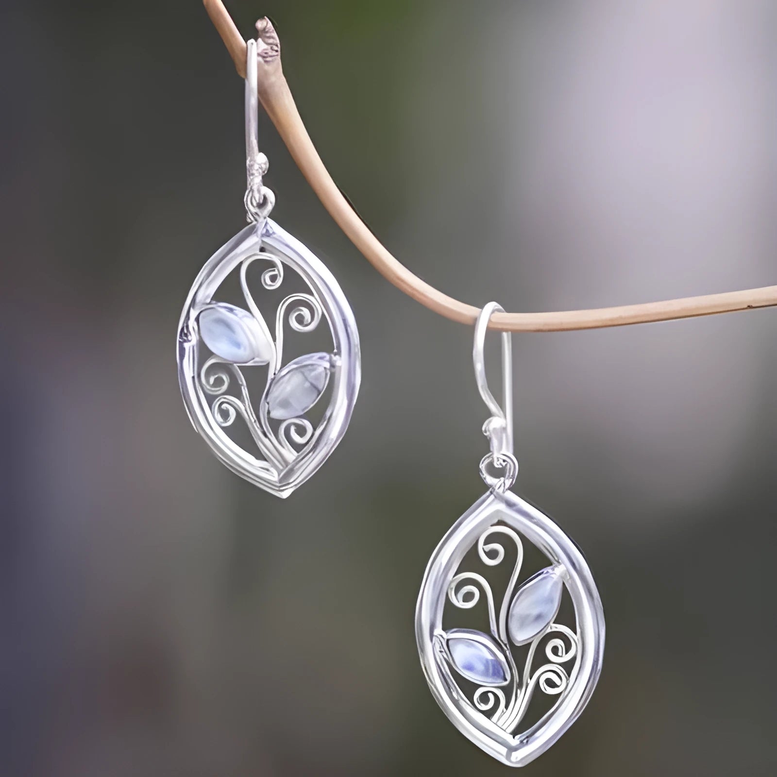 Women's silver alloy earrings with colourful moonstone embedded in leaf design